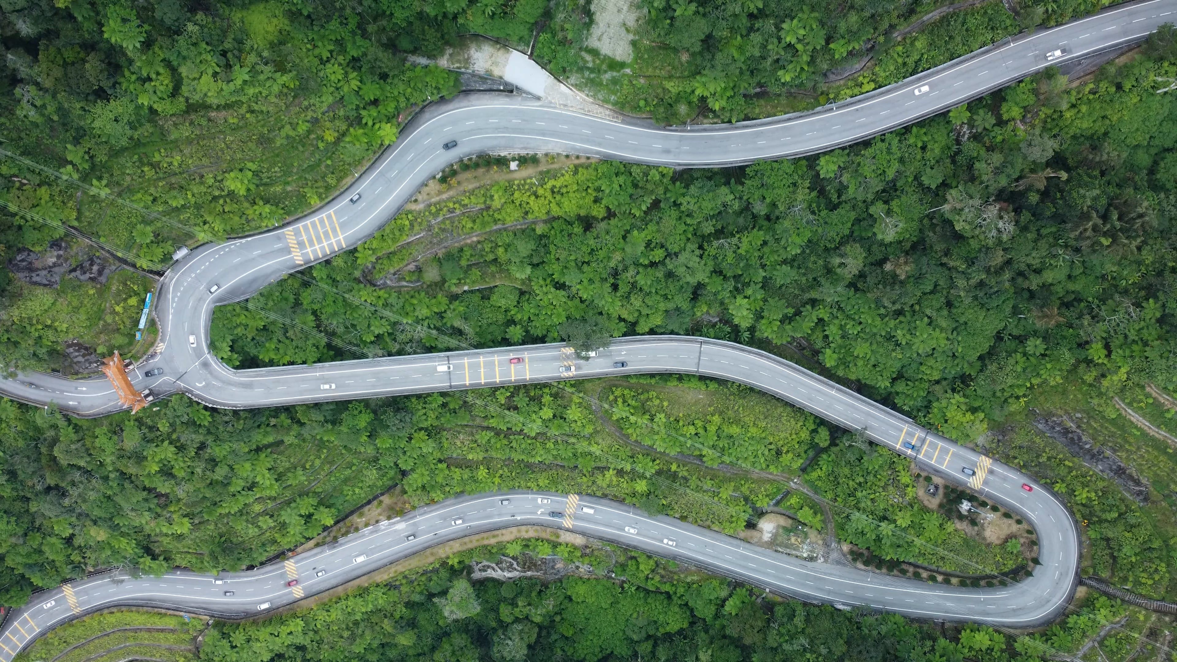 Aerial Footage of a Winding Road and a Green Forest Free Stock Video ...
