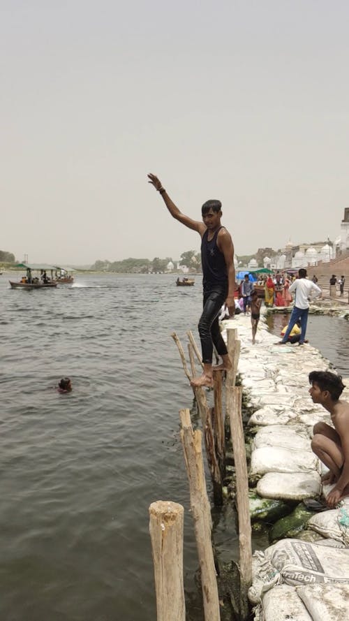 Man Jumping into River in Slow Motion