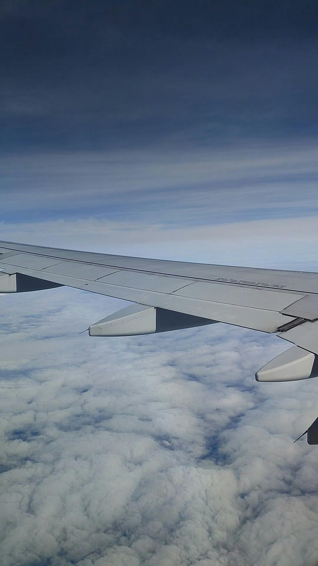 View of Sky and Clouds from a Flying Airplane Free Stock Video Footage