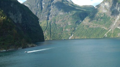 Boats Sailing On A Huge Body Of Water