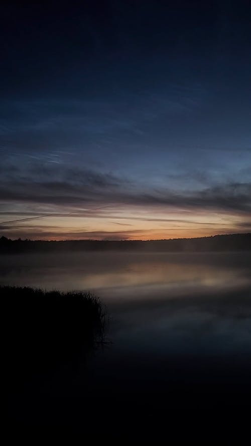Time Lapse of Fog Over a Lake at Sunrise
