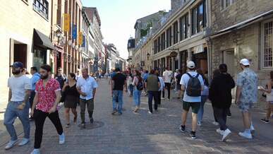 people visiting saint paul street in old montreal