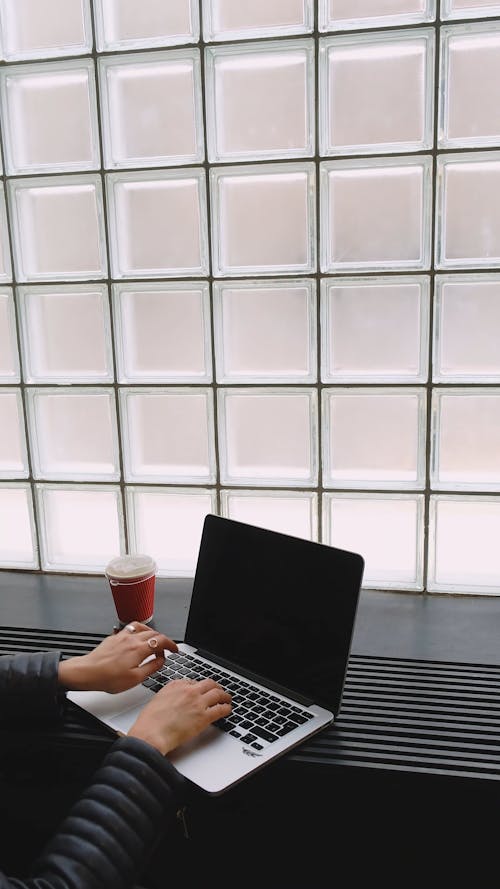 Female Hands Typing on a Laptop Computer 