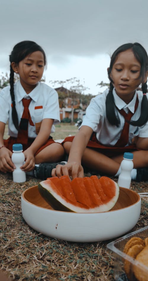 Schoolgirls Eating Watermelon