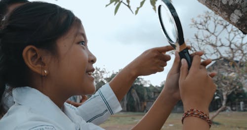 Teacher and Student with Magnifier