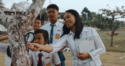 Teacher with Children on a Field Trip Looking at a Tree