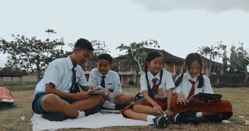 Boys and Girls in School Uniforms on Picnic