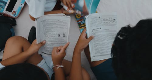 Schoolchildren with Textbooks at a Field Trip