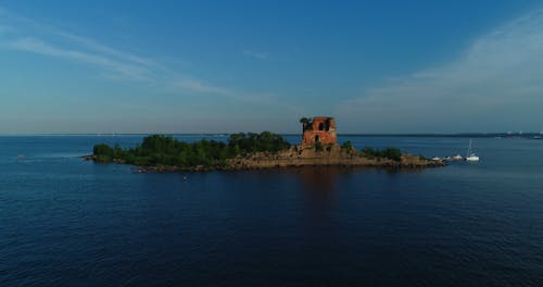 Drone Footage of the Ruins of an Old Castle on a Small Island 