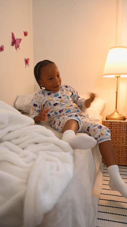 Boy Playing with Toys in his Bedroom