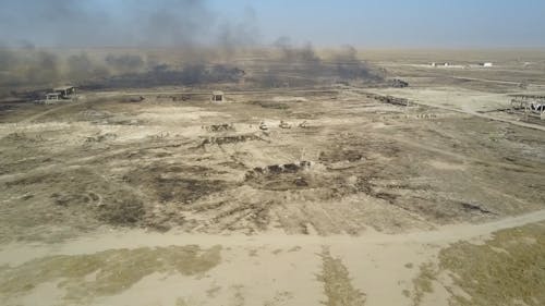 Drone Shot of Military Exercises at a Training Ground in a Desert