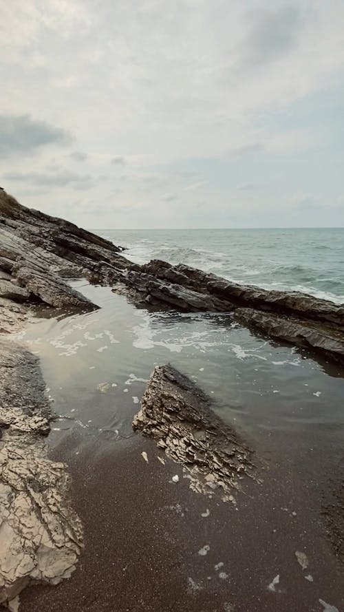 Waves Crashing against a Rocky Coast