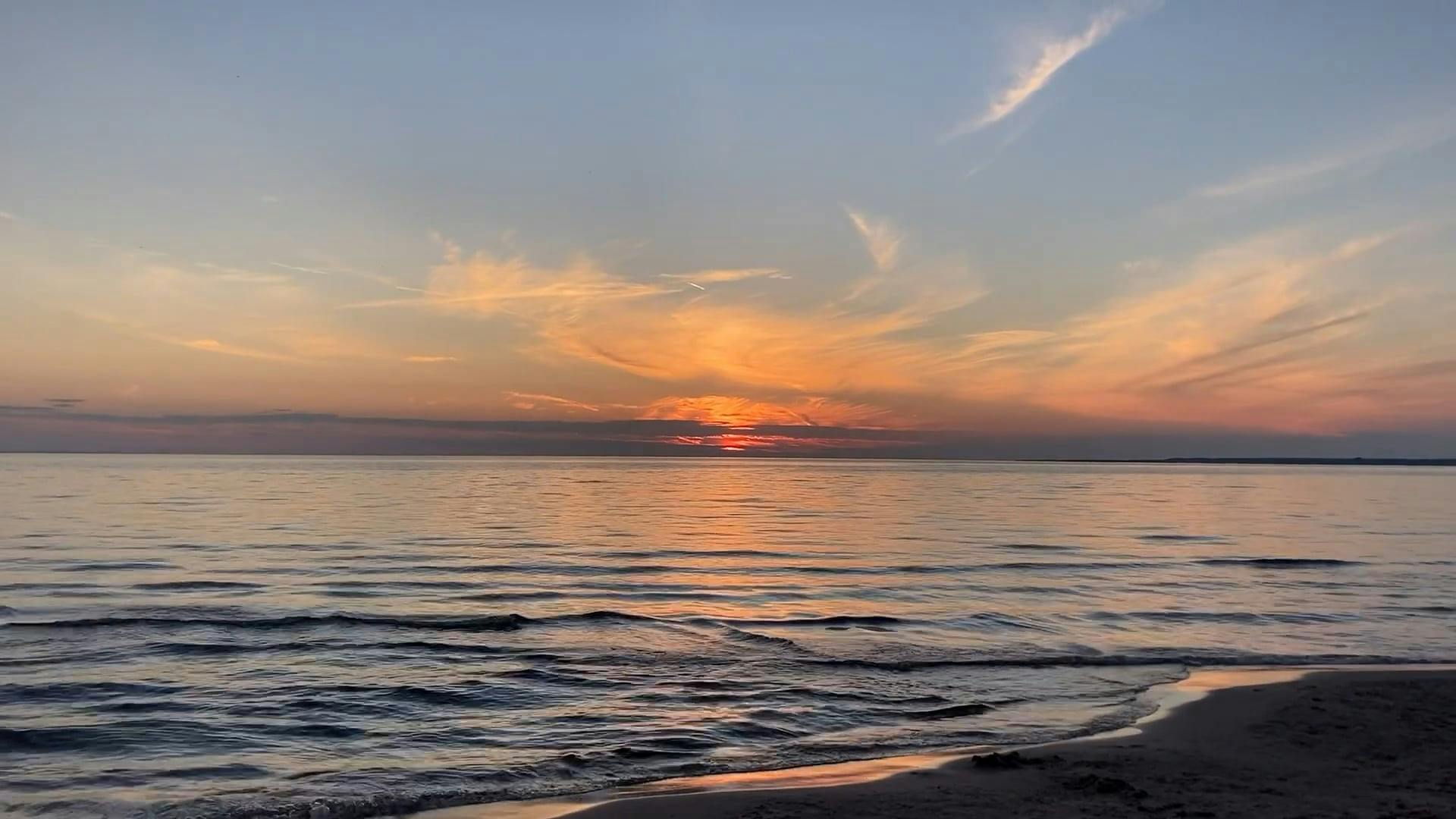 waves in a sea at sunset 12785202