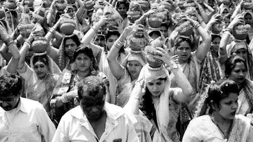 Crowd Carrying Vases on Heads