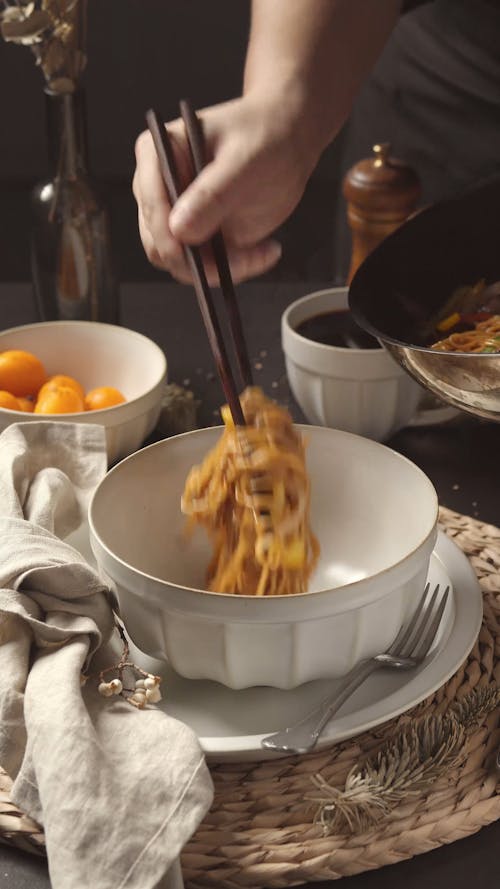 Man Preparing a Noodle Meal