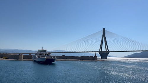 Footage with a Ship and a Bridge during a Sunny Weather