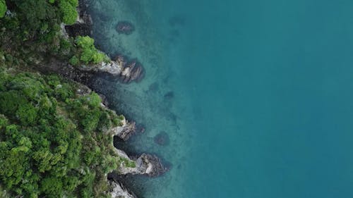 Top View of a Cliffed Coastline and Turquoise Waters 
