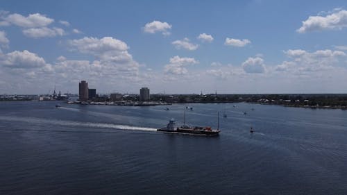 Vessel Sailing near City