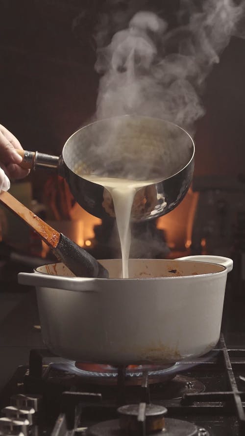 Pouring Hot Liquid to Pot