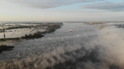 Drone View of Thick Morning Fog over the River and the City