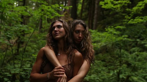Women Hugging in Forest