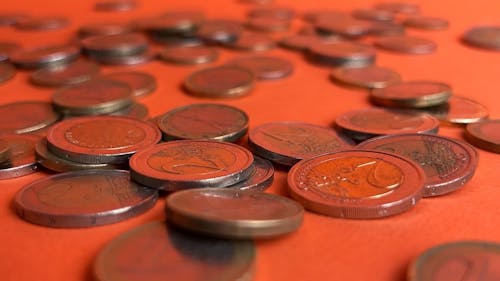 Close up View of Euro Coins on an Orange Surface 