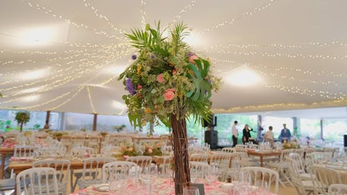 Close up of a Floral Arrangement in a Wedding Tent 
