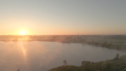 Fog over a Lake at Sunrise 