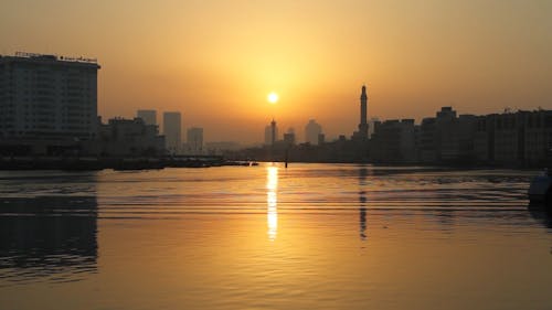Dubai Old City Skyline against an Orange Sunset Sky 