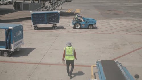 Men Working on Airport Tarmac