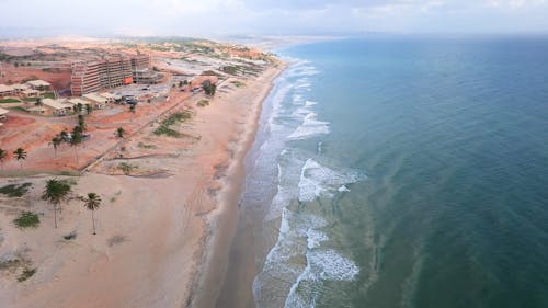 Aerial View of a Breaking Waves on a Sandy Coastline