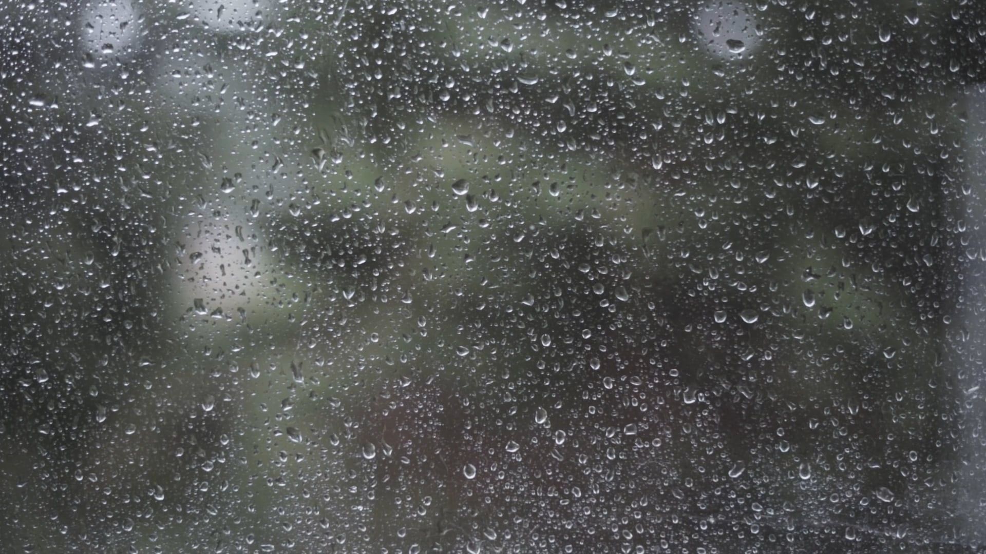 raindrops on a window glass 13292544