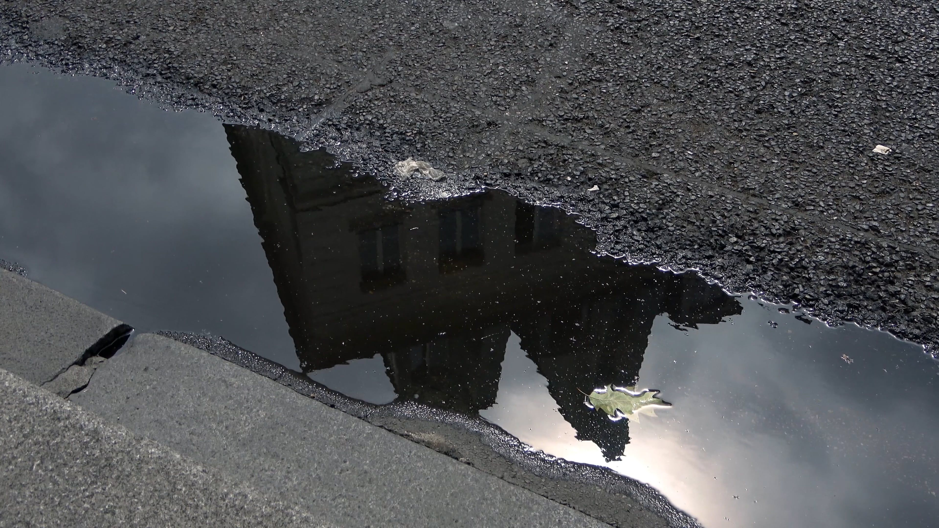 A Building Reflected on a Pond in the Street Free Stock Video Footage ...