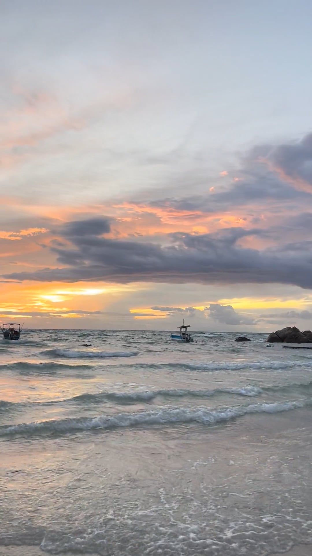 boats anchored near the shore of a tropical island at sunset 13321333