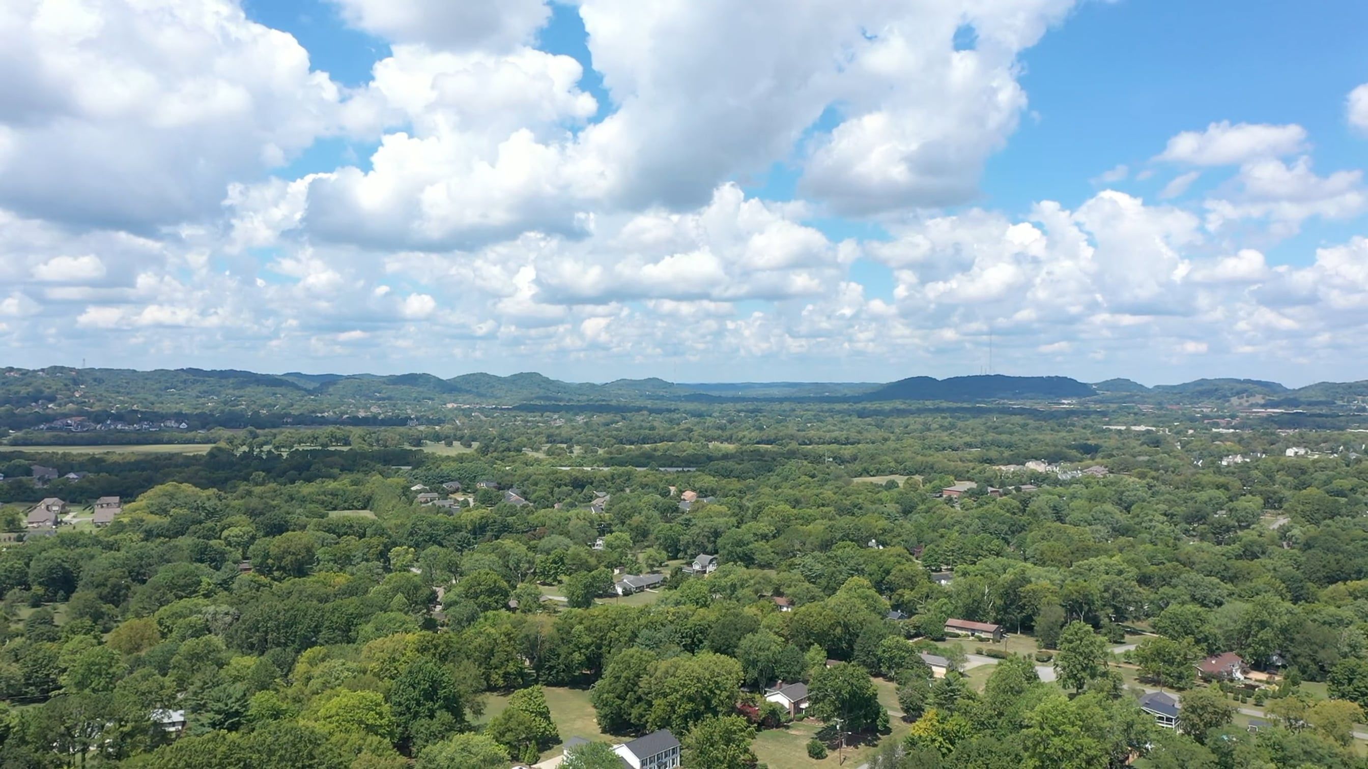 Drone Footage of a Suburban Area with Green Trees Free Stock Video ...