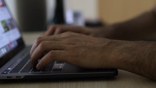 Hands Typing on Keyboard