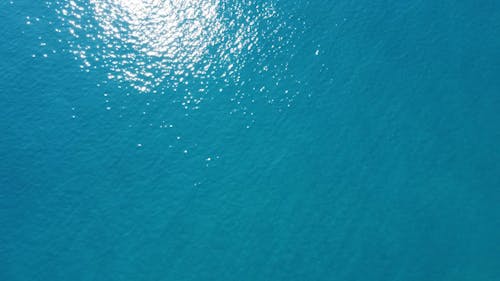 Ripples and Light Reflections on Turquoise Sea Water 