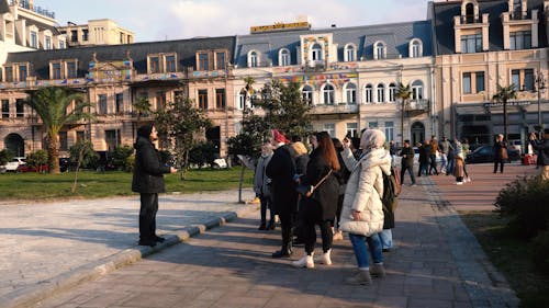 Tour Guide Speaking in Town