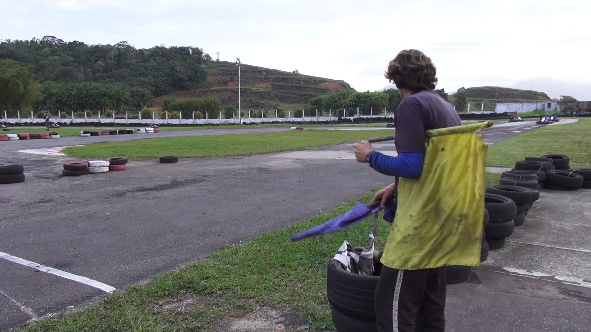 Woman Waving Blue Flag in Karting Race Free Stock Video Footage