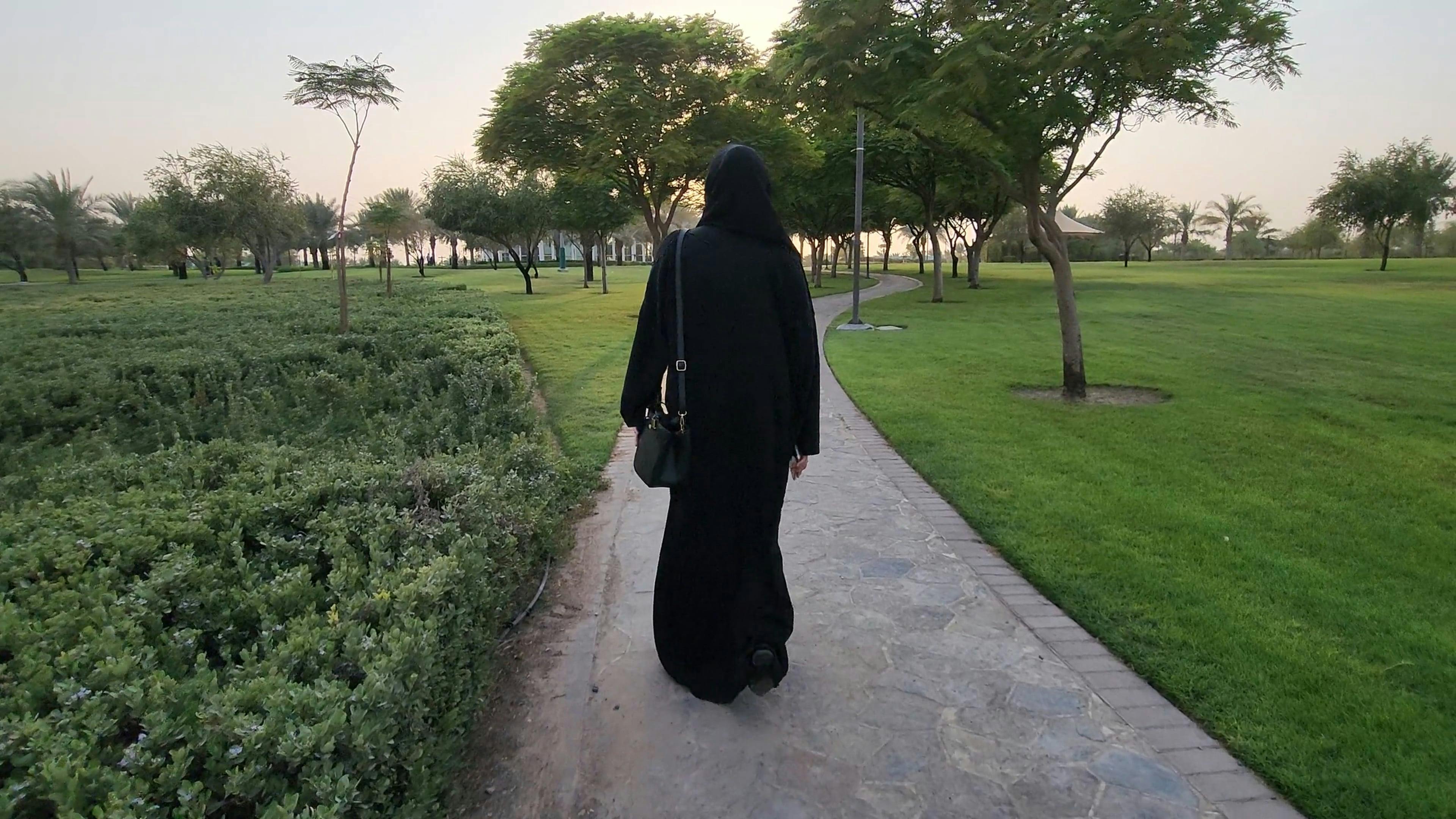 Woman in Abaya and Hijab Walking in Park Free Stock Video Footage,  Royalty-Free 4K & HD Video Clip