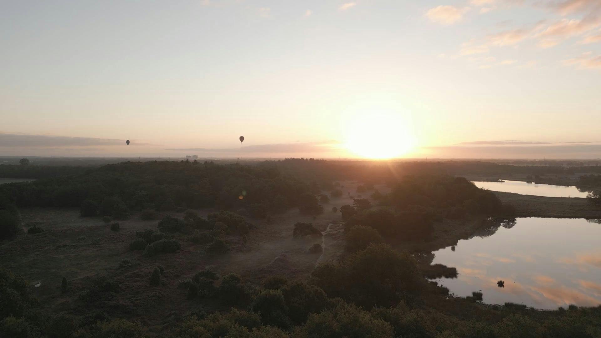 Drone Footage of Hot Air Balloons Flying at Sunrise Free Stock Video
