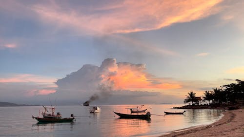 Boats Anchored near the Shore at Sunset