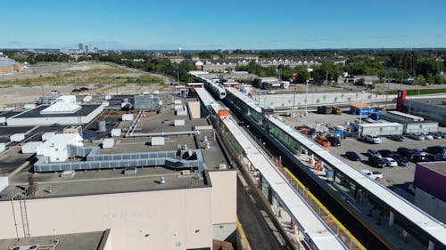 Drone Footage of a Train Running through a Suburban Area