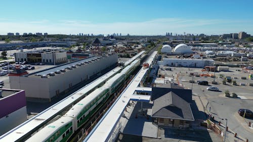 Drone View of a Train Running through a Suburban Area