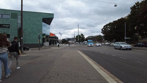 Time Lapse of a Busy Street under a Cloudy Sky