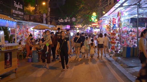 Pedestrians on City Street at Night