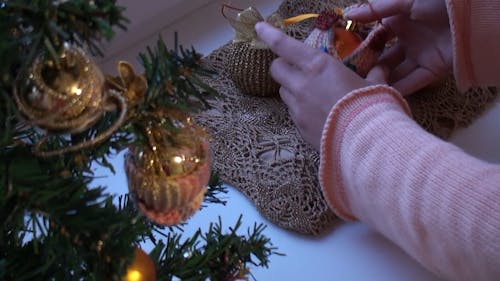 Hands with Christmas Bulbs