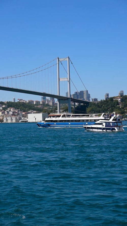 A Ferry Boat and a Yacht in the Bosphorus Strait 