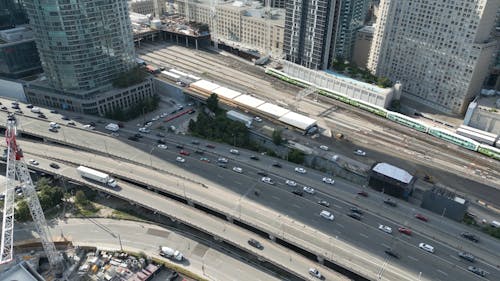 Drone Footage of a Highway and a Rail Yard in Toronto City 