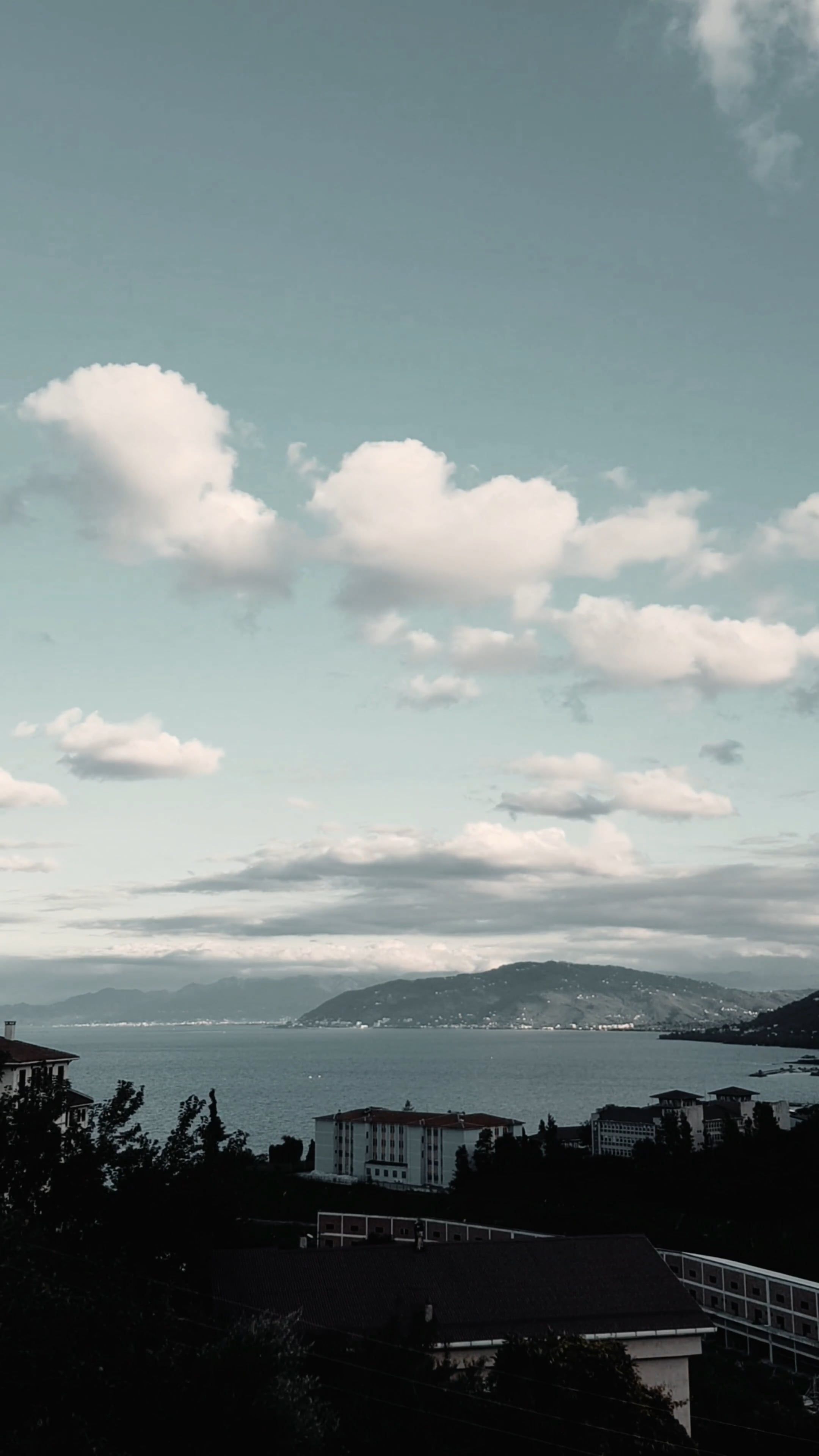 Time Lapse of Moving Clouds over a Town by the Sea Free Stock Video ...